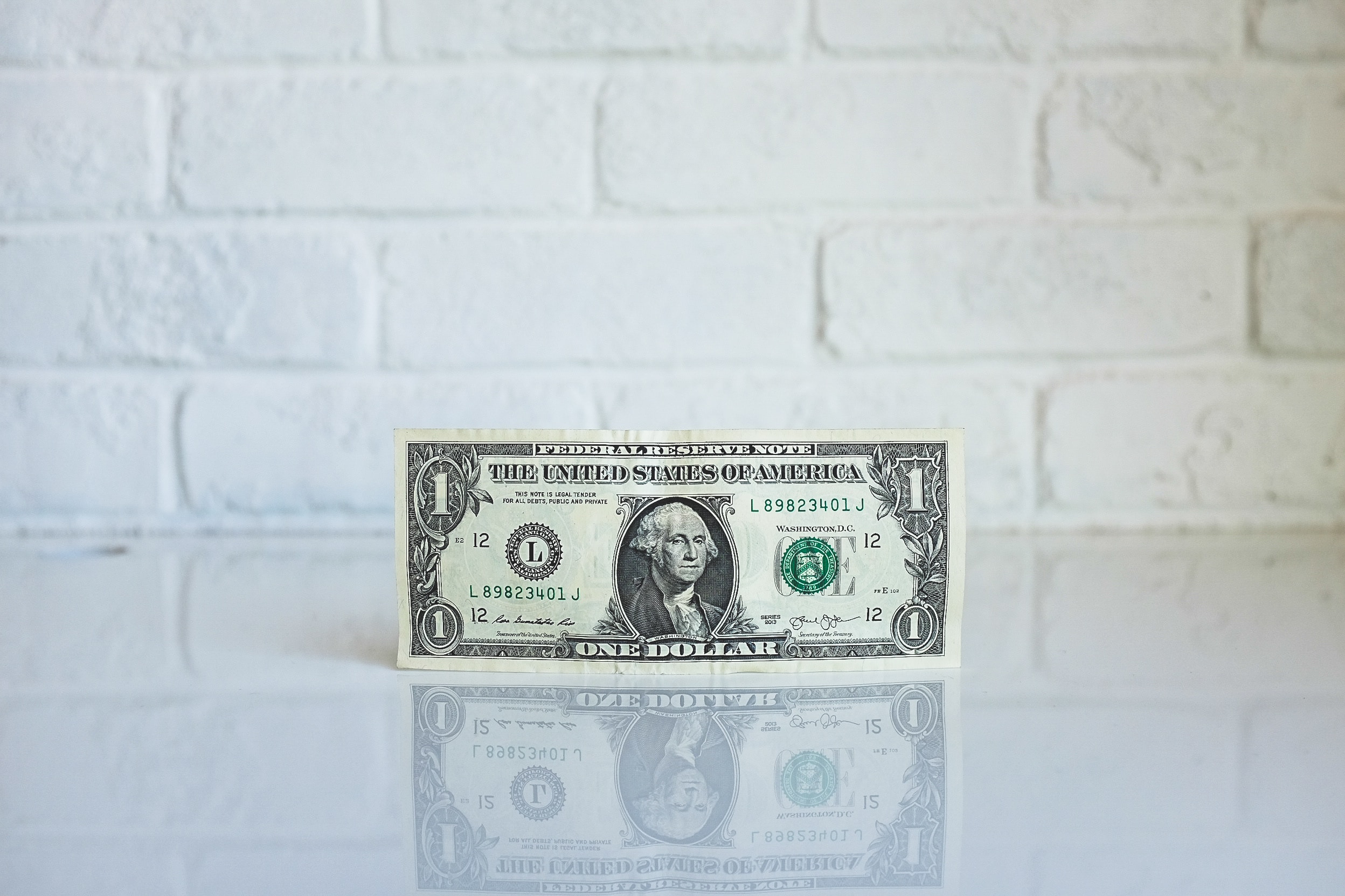1 U.S. dollar banknote on white surface